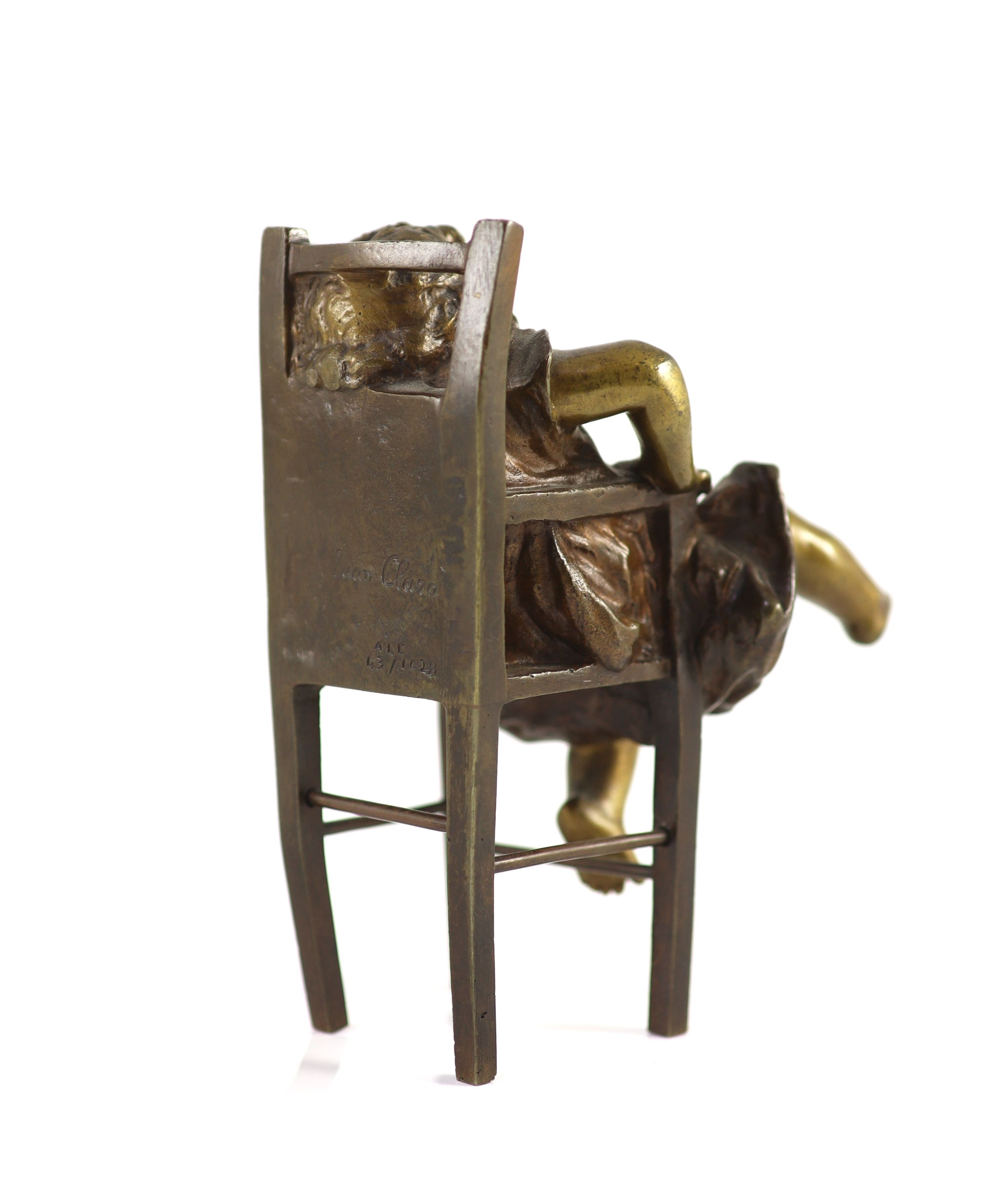 After Joan Clarà (1875 - 1958). A pair of bronze models of girls playing on chairs, height 15.5cm